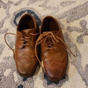 Brown wingtip style dress shoes